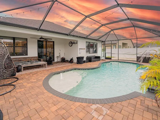 a view of a swimming pool with a patio