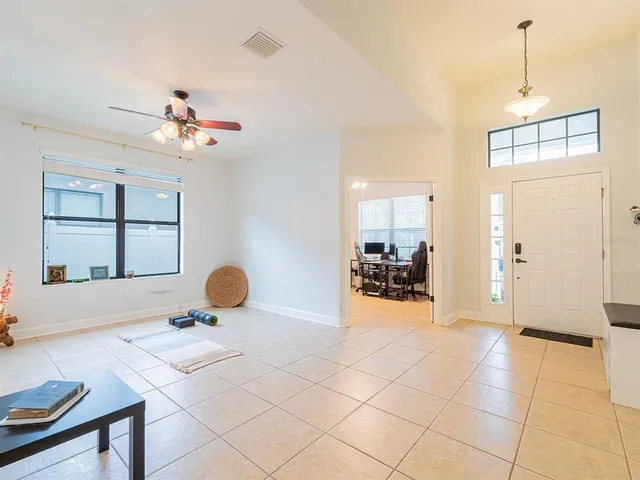a view of a livingroom with furniture and a window