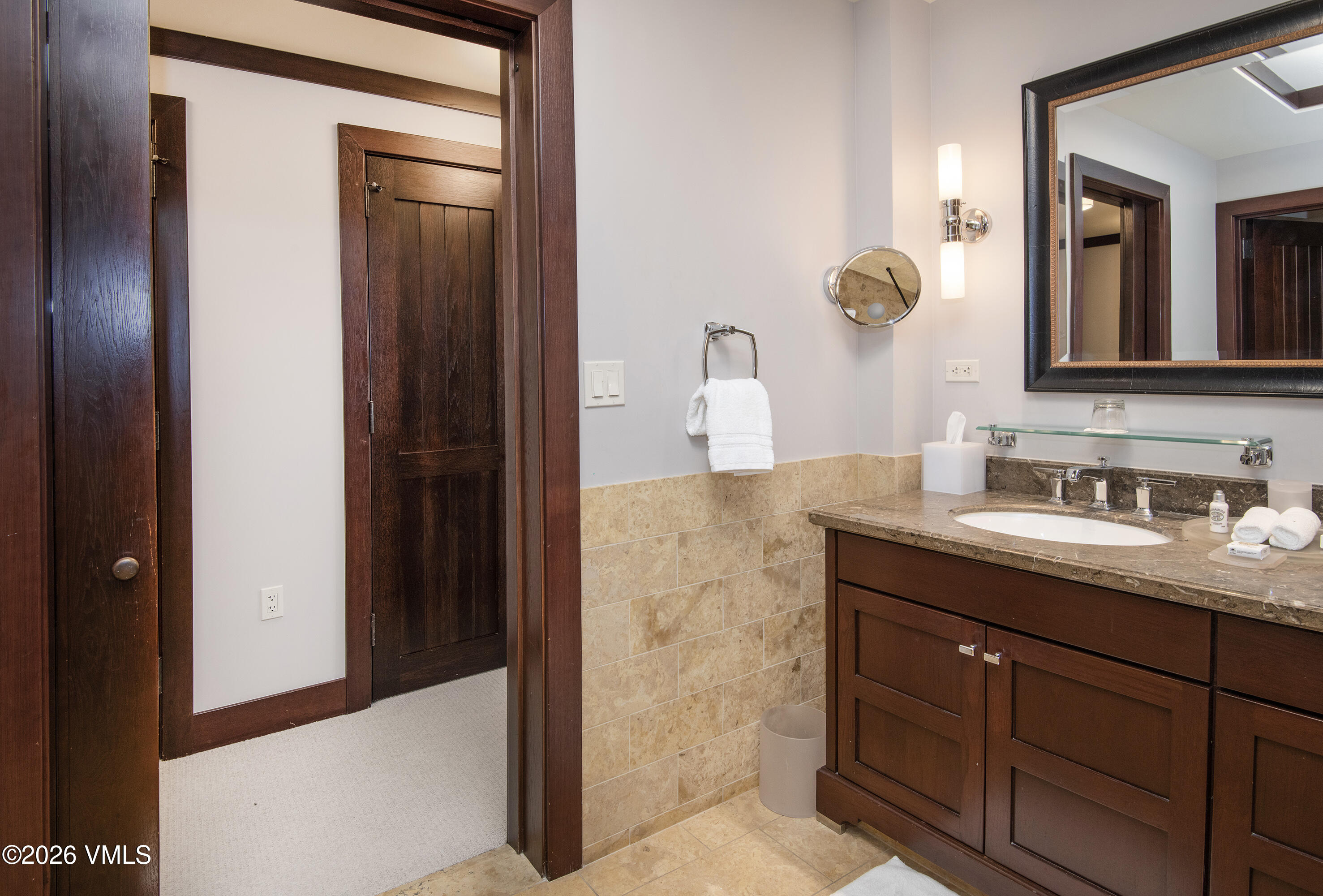 1 Vail Road, Unit 5102C Vail, CO 81657 - Photo 8 of 13 a bathroom with a granite countertop sink and a mirror