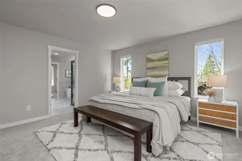 a bedroom with a bed and a lamp on table