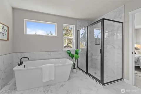 a bathroom with a bathtub and a shower