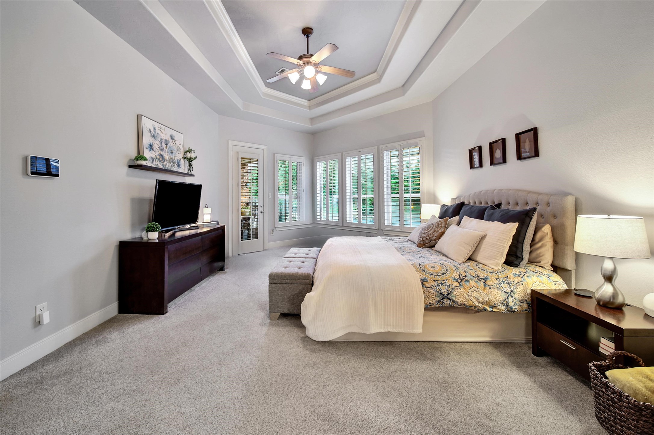 5902 Royal Hill Court Kingwood, TX 77345 - Photo 14 of 43 a spacious bedroom with a bed and a flat screen tv