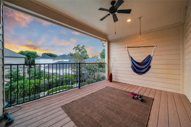a view of a balcony with wooden floor