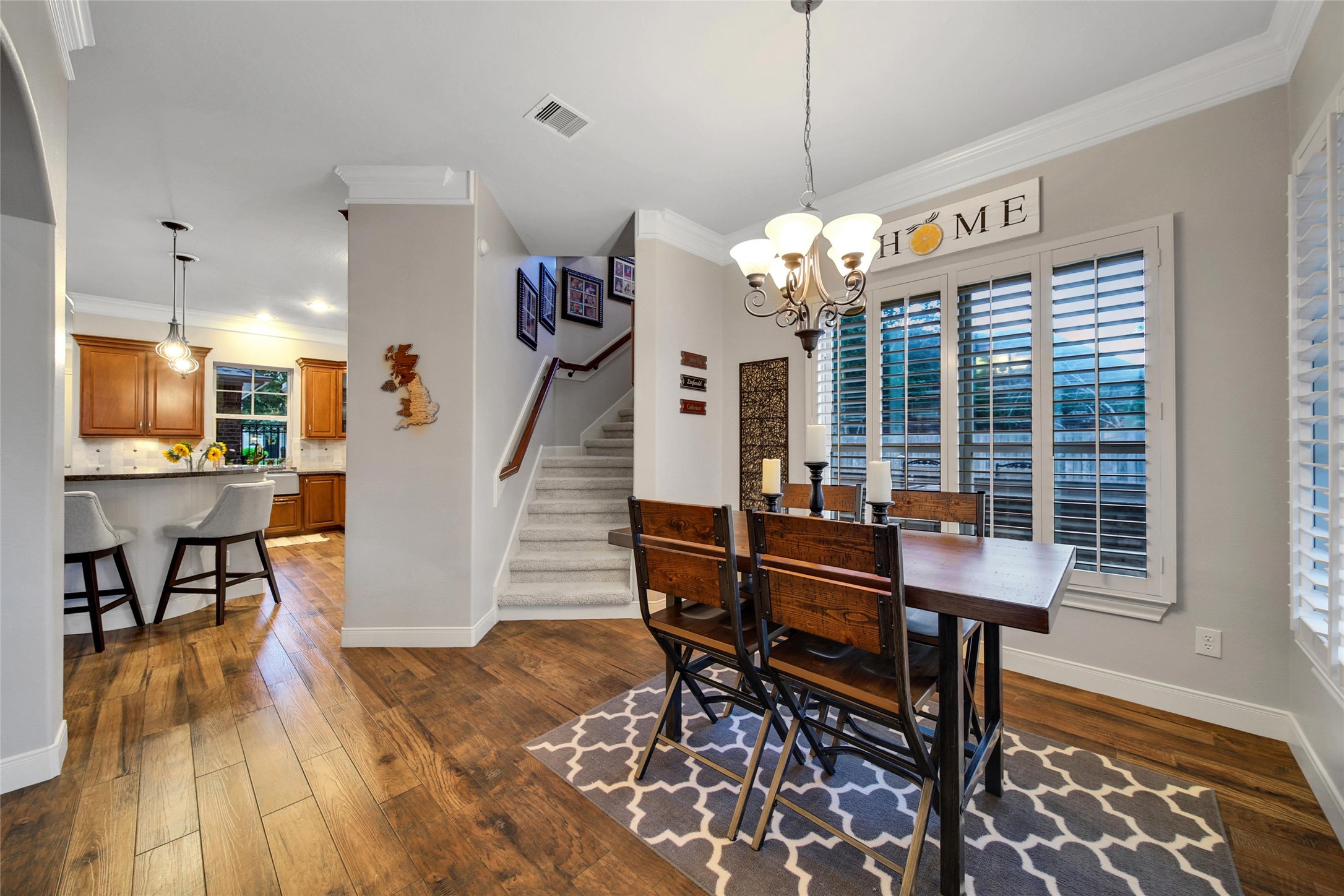 5902 Royal Hill Court Kingwood, TX 77345 - Photo 24 of 43 a view of a dining room with furniture window and wooden floor