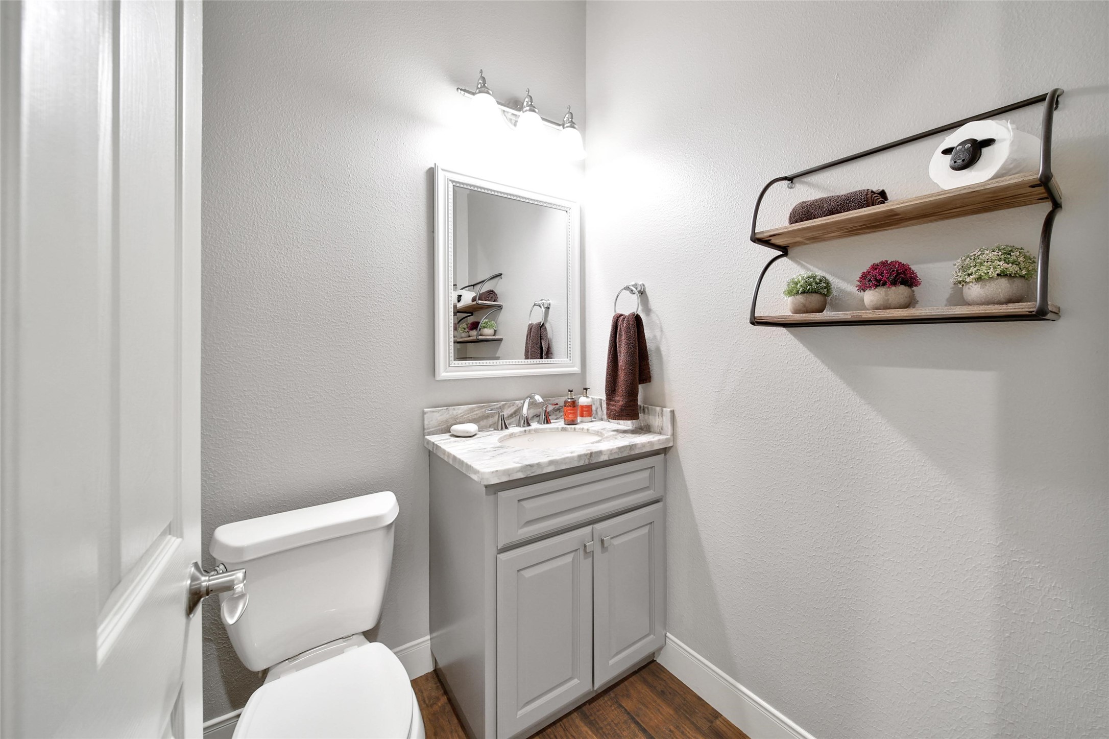5902 Royal Hill Court Kingwood, TX 77345 - Photo 25 of 43 a bathroom with a toilet a sink and mirror