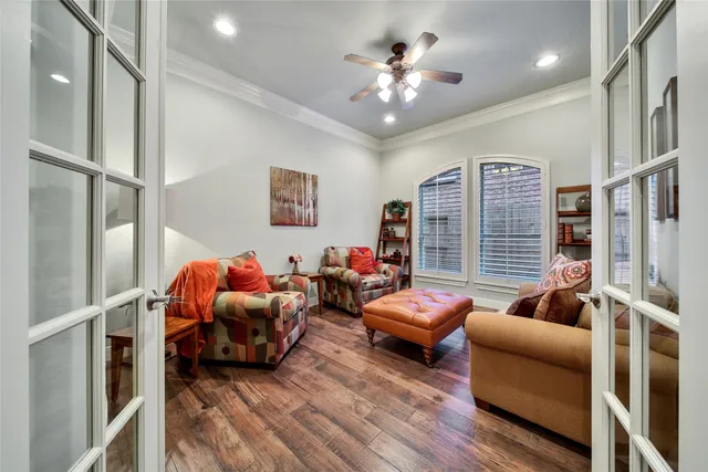 a bedroom with furniture and a chandelier