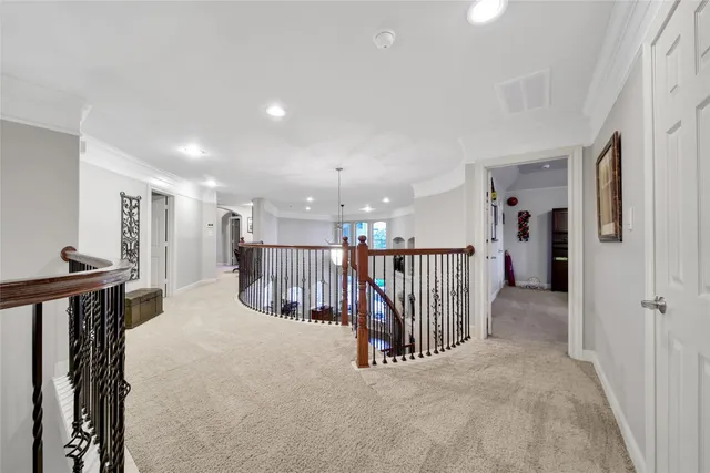 a view of a hallway with a furniture and staircase