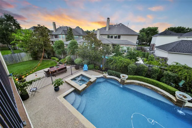 a view of a chairs and table in a backyard