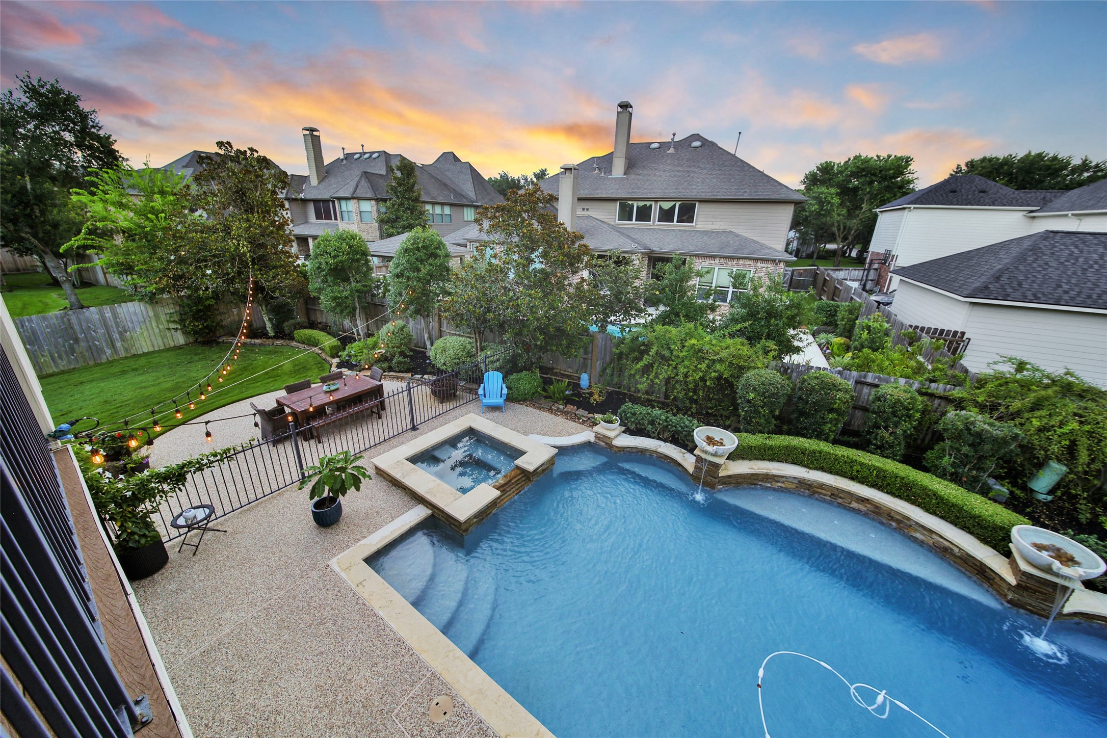5902 Royal Hill Court Kingwood, TX 77345 - Photo 40 of 43 a view of a chairs and table in a backyard
