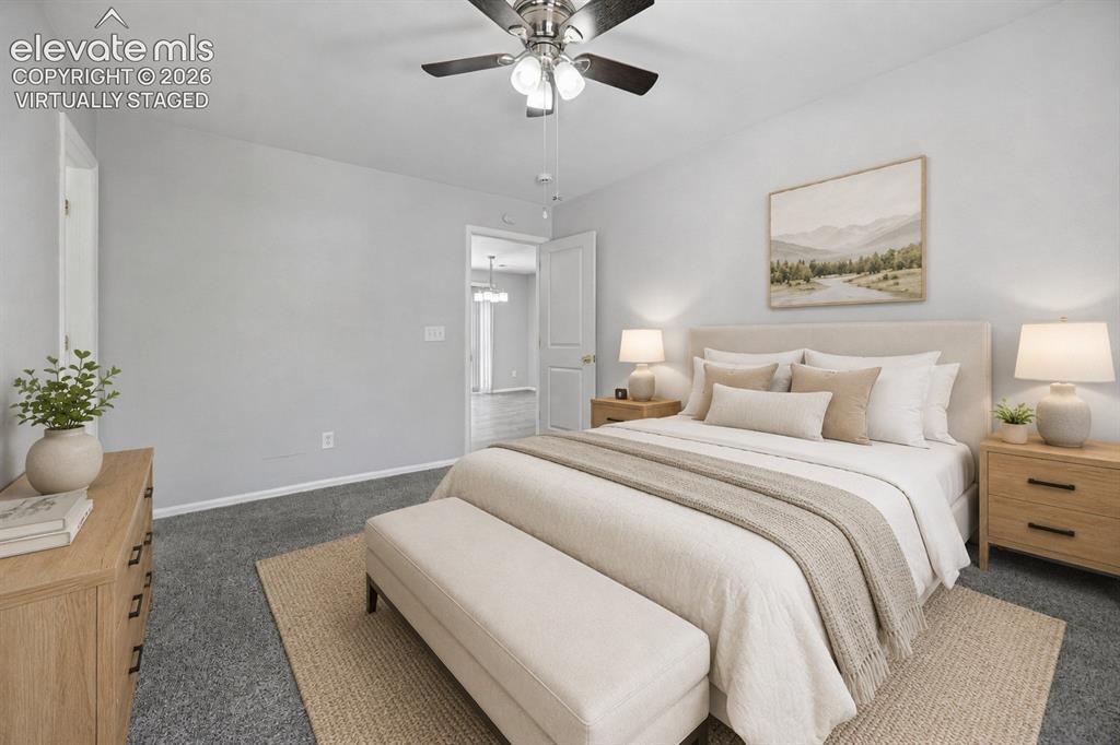 431 Kitfield View Colorado Springs, CO 80916 - Photo 17 of 27 a bedroom with bed and painting on the wall
