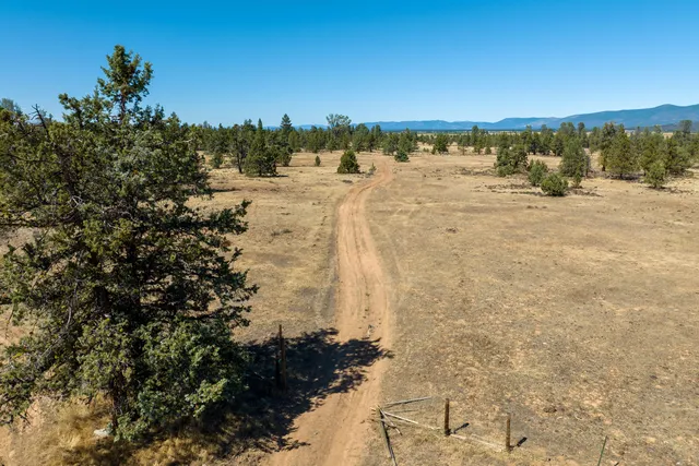 a view of a road with a mountain in the background