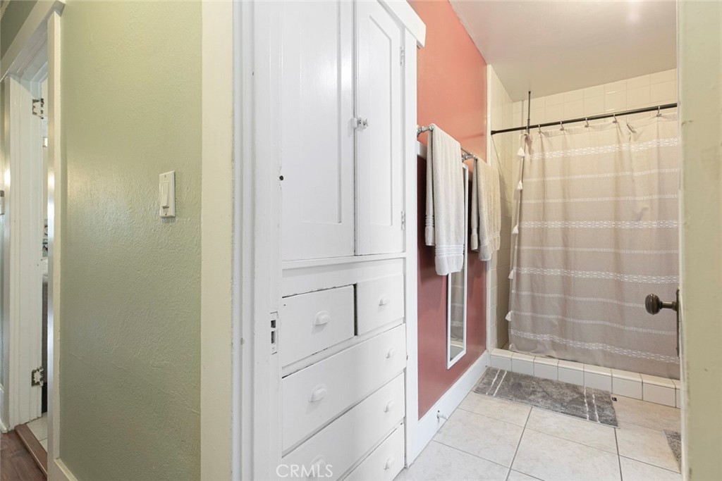 408 East Del Mar Boulevard Pasadena, CA 91101 - Photo 14 of 19 a bathroom with a glass shower door