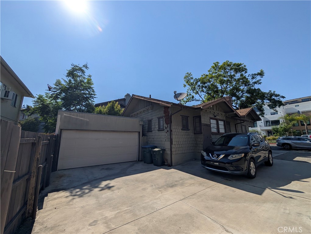 408 East Del Mar Boulevard Pasadena, CA 91101 - Photo 3 of 19 a front view of a house with a yard and garage
