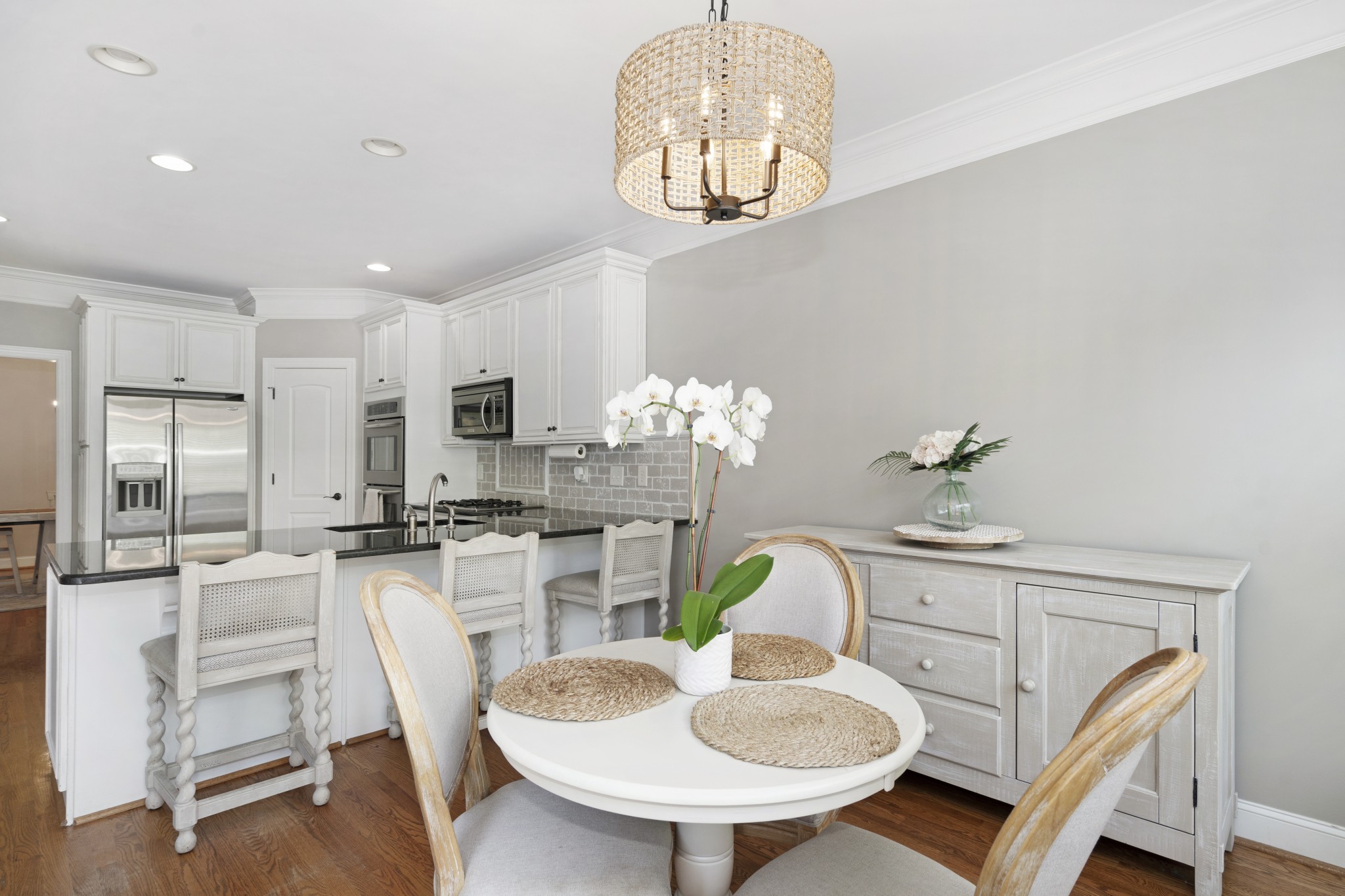 2003 Bathurst Court Spring Hill, TN 37174 - Photo 11 of 30 a dining room with furniture a chandelier and kitchen view