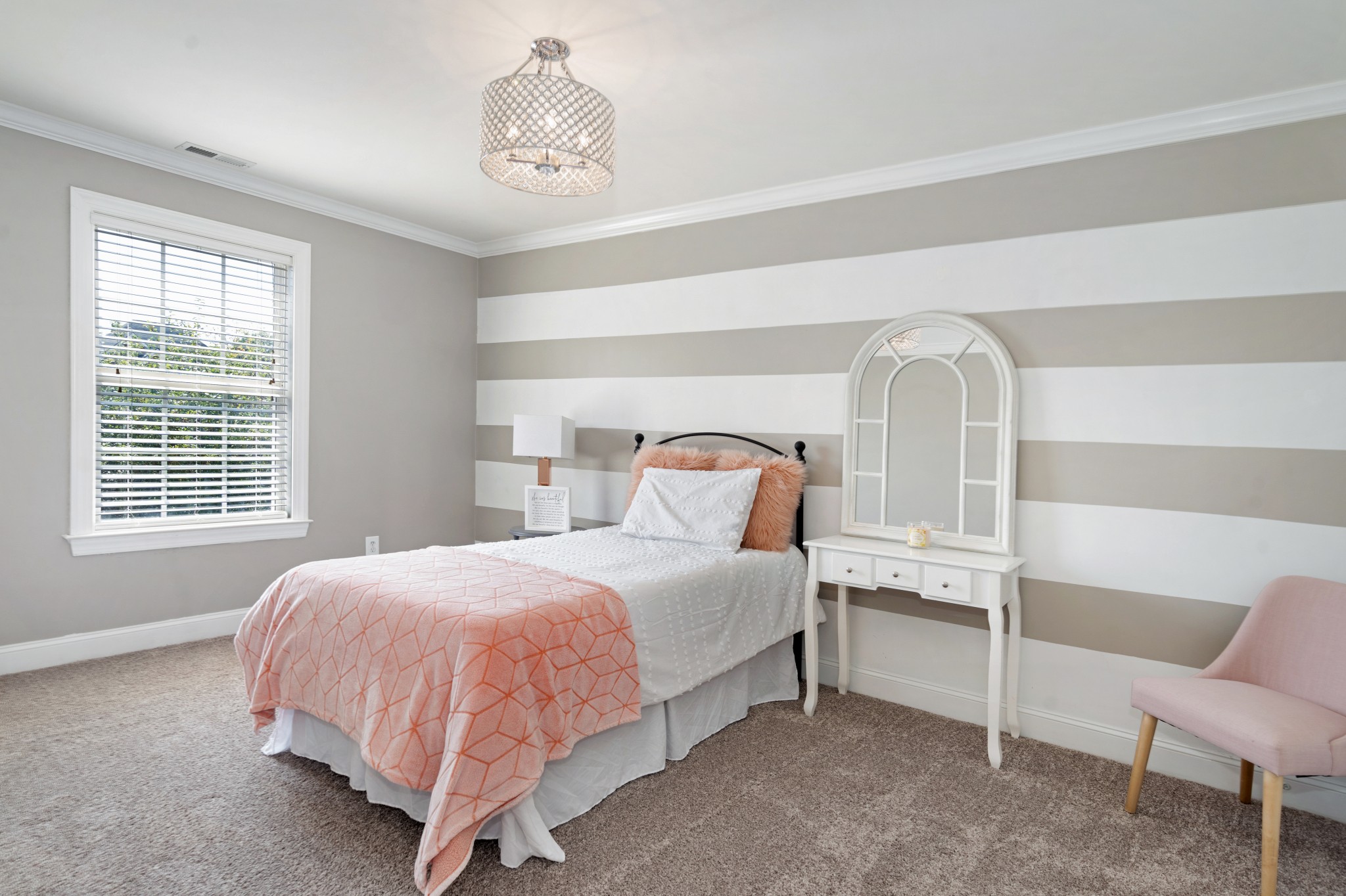 2003 Bathurst Court Spring Hill, TN 37174 - Photo 19 of 30 a bedroom with a bed and a chandelier