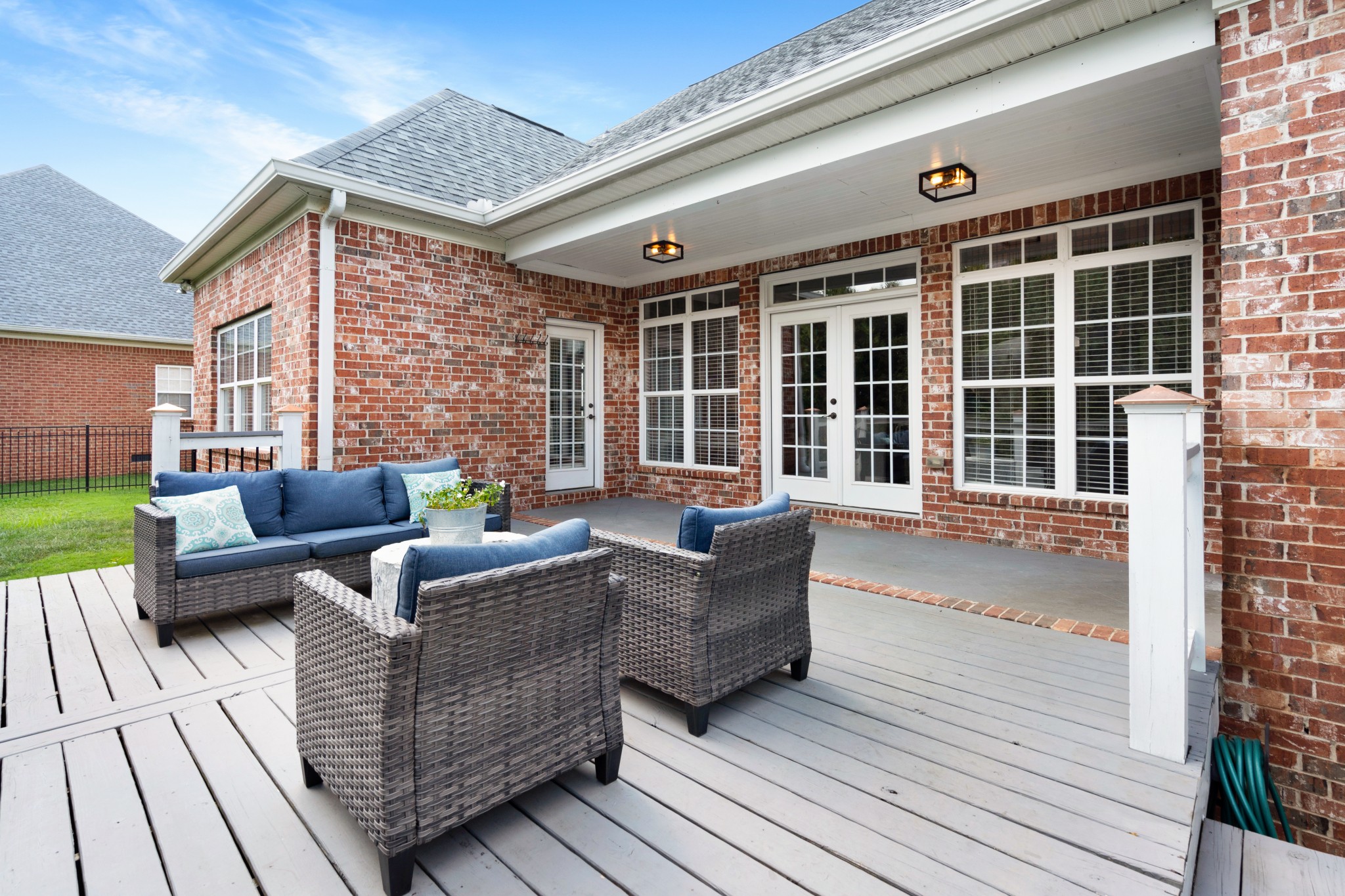 2003 Bathurst Court Spring Hill, TN 37174 - Photo 23 of 30 a view of a patio with couches chairs dining table and wooden floor