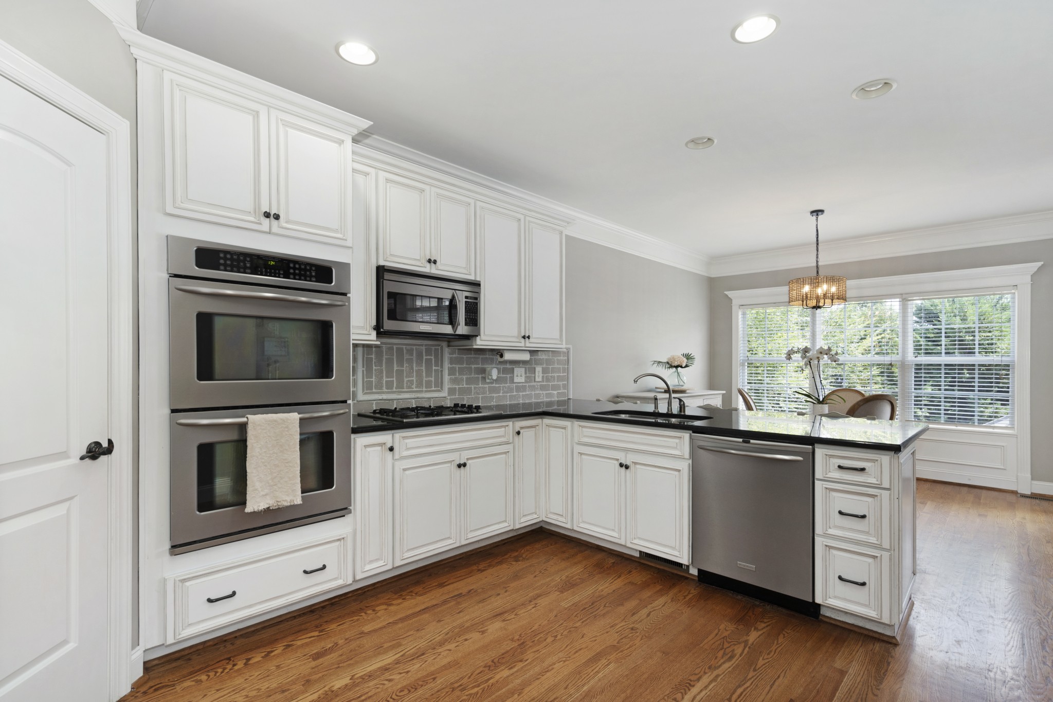 2003 Bathurst Court Spring Hill, TN 37174 - Photo 9 of 30 a kitchen with sink a microwave and cabinets