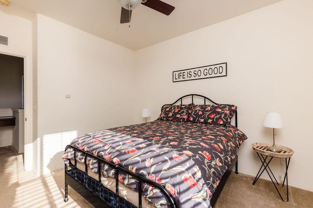 3953 Harlan Ranch Boulevard Clovis, CA 93619 - Photo 11 of 31 a bedroom with a bed a table and chair