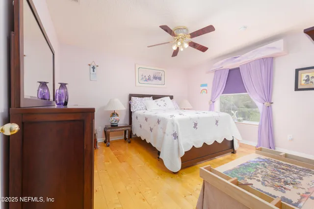 a bathroom with double vanity and a mirror