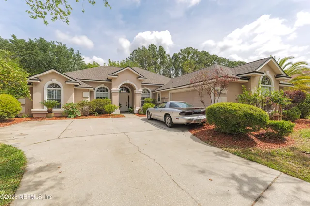 a view of a house with backyard sitting area and porch