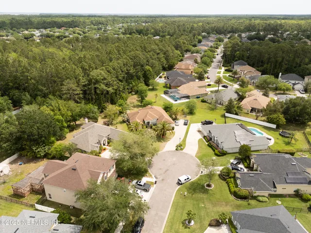 an aerial view of a house with outdoor space