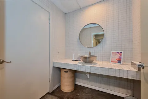 a bathroom with a sink and a mirror