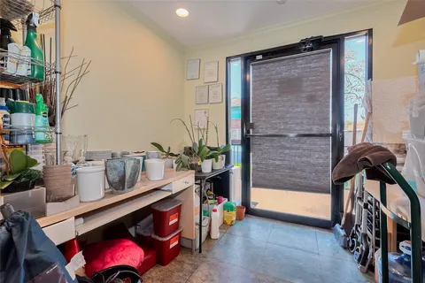 a view of an entryway with wooden floor