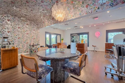 a living room with furniture a table and chairs