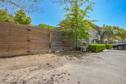 a view of a car is parked in front of a house