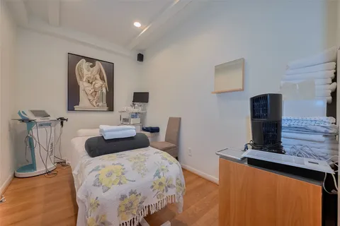 a bedroom with furniture and a bed