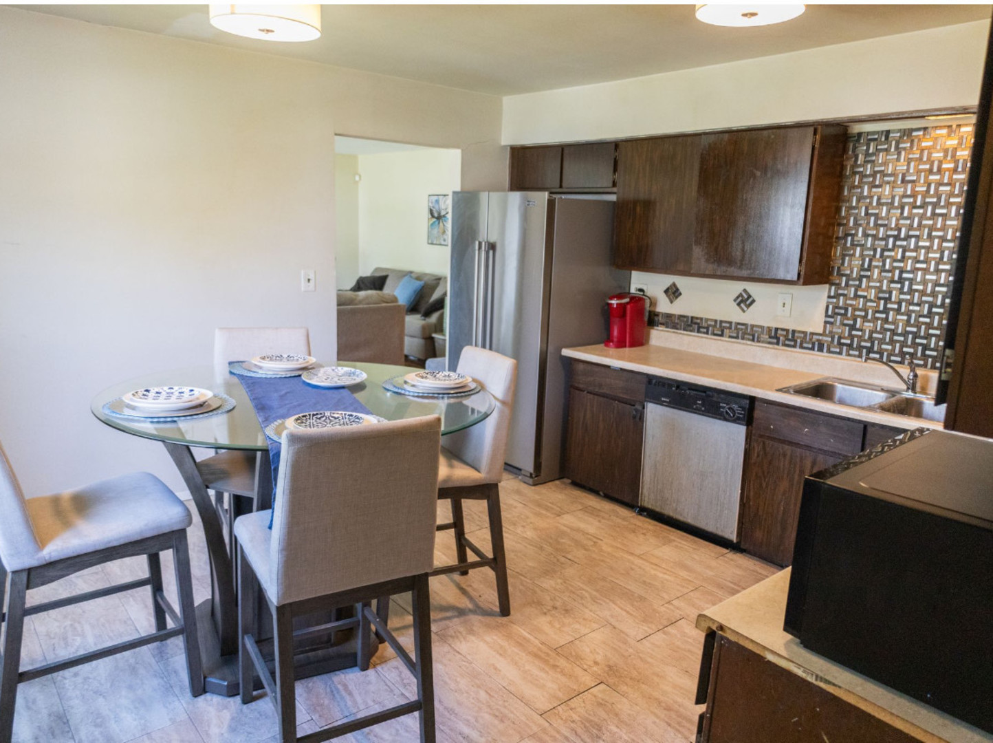 517 Nathan Road University Park, IL 60484 - Photo 8 of 12 a kitchen with a table chairs refrigerator and microwave