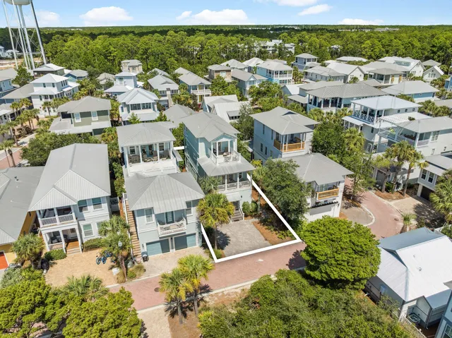 a spacious bedroom with a bed and a chandelier
