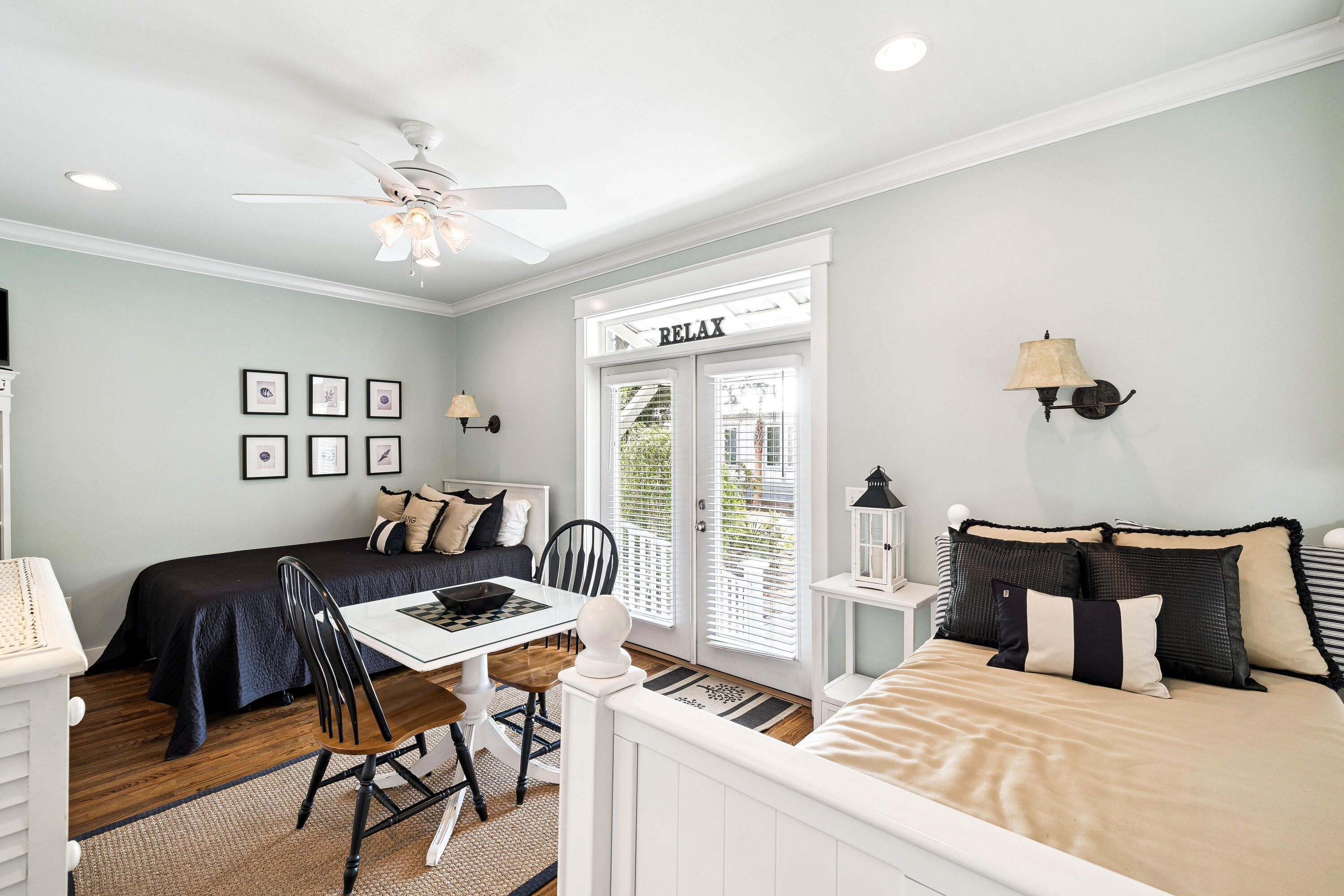 54 Surfer Lane Seacrest, FL 32461 - Photo 22 of 47 a bedroom with a bed and wooden floor