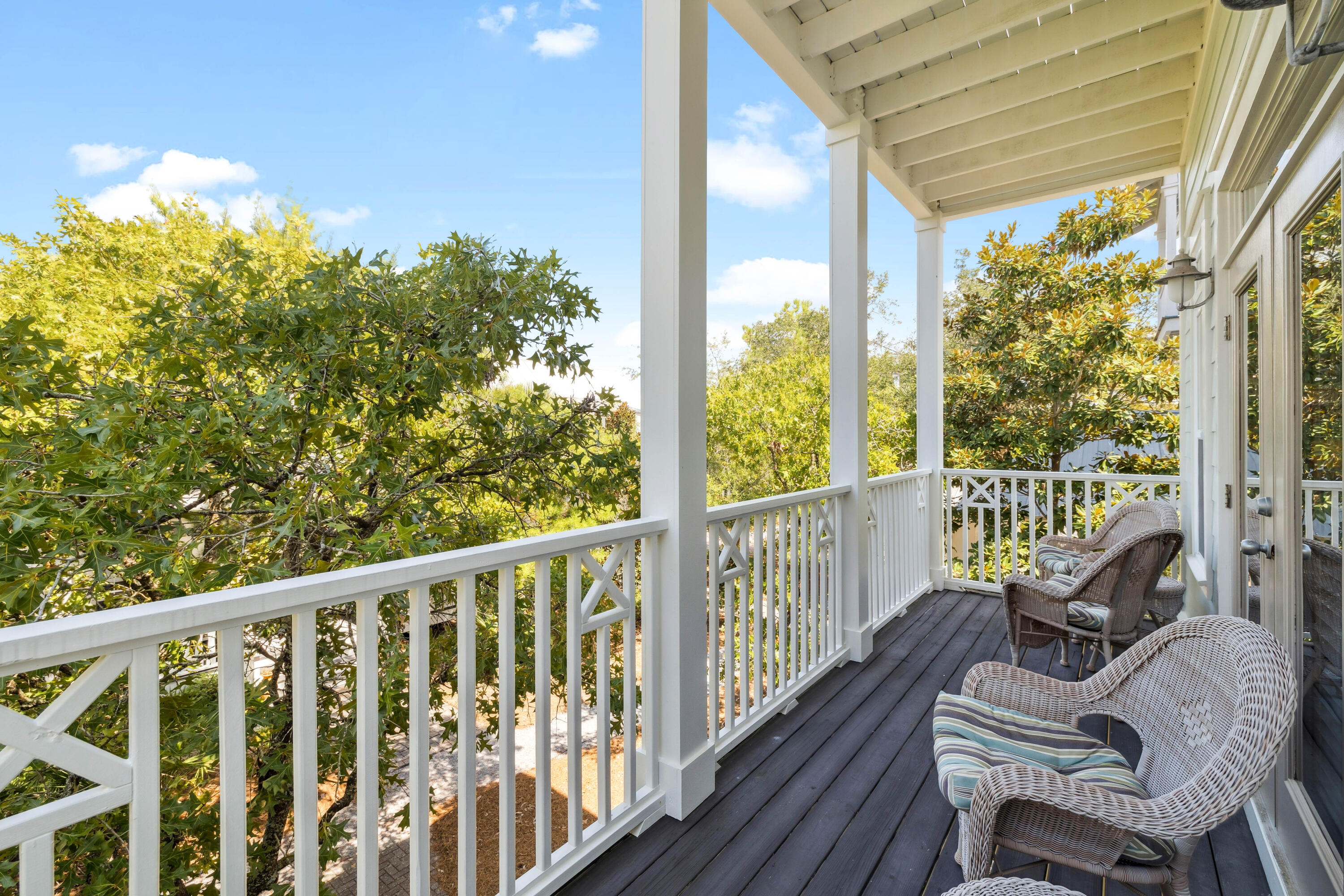 54 Surfer Lane Seacrest, FL 32461 - Photo 31 of 47 a view of a balcony with chair and wooden fence