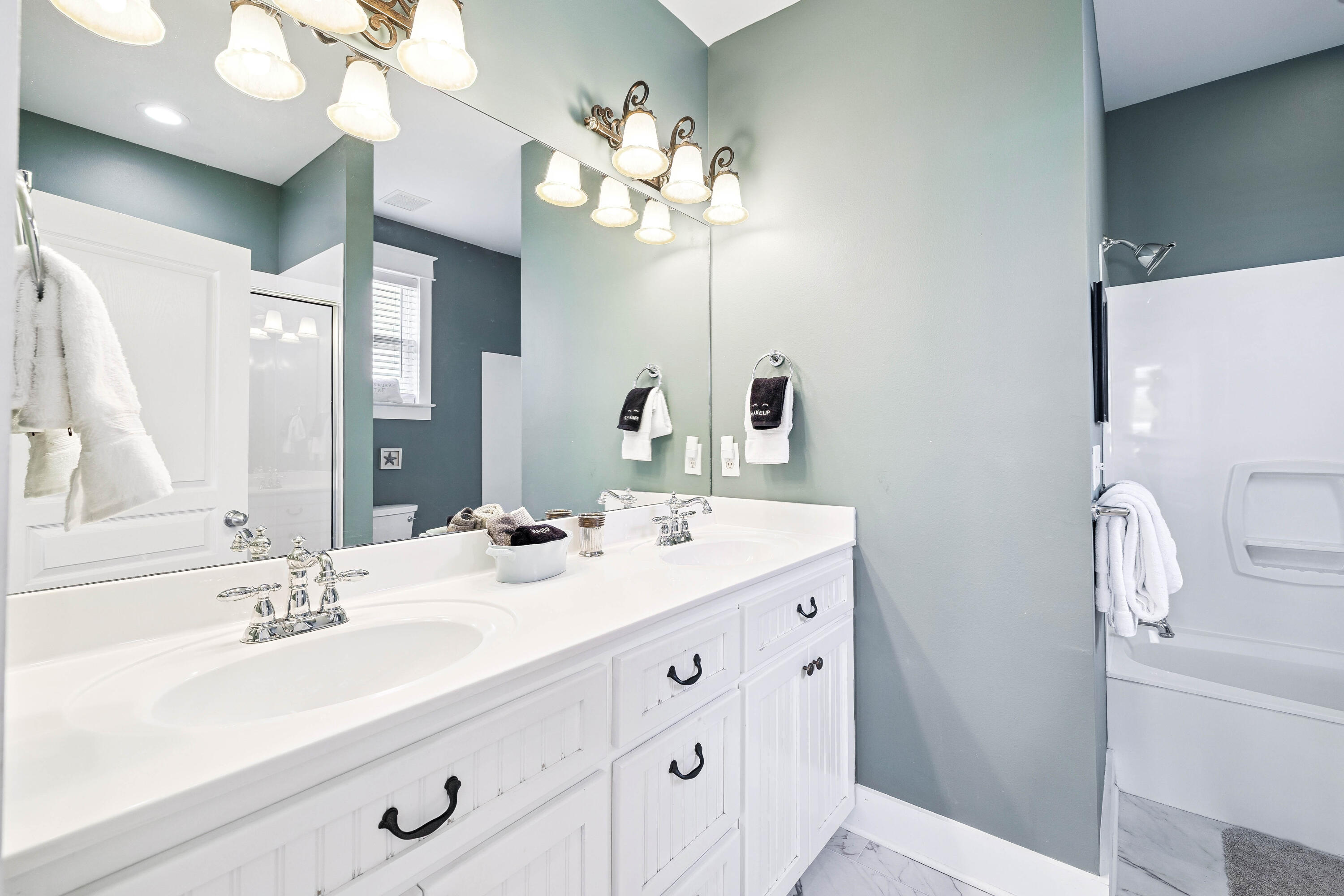 54 Surfer Lane Seacrest, FL 32461 - Photo 40 of 47 a bathroom with a double vanity sink and a mirror