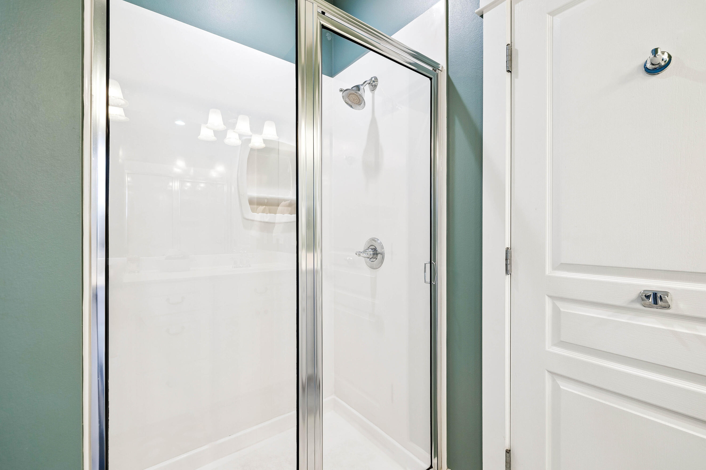 54 Surfer Lane Seacrest, FL 32461 - Photo 42 of 47 a bathroom with a glass shower door and a glass door