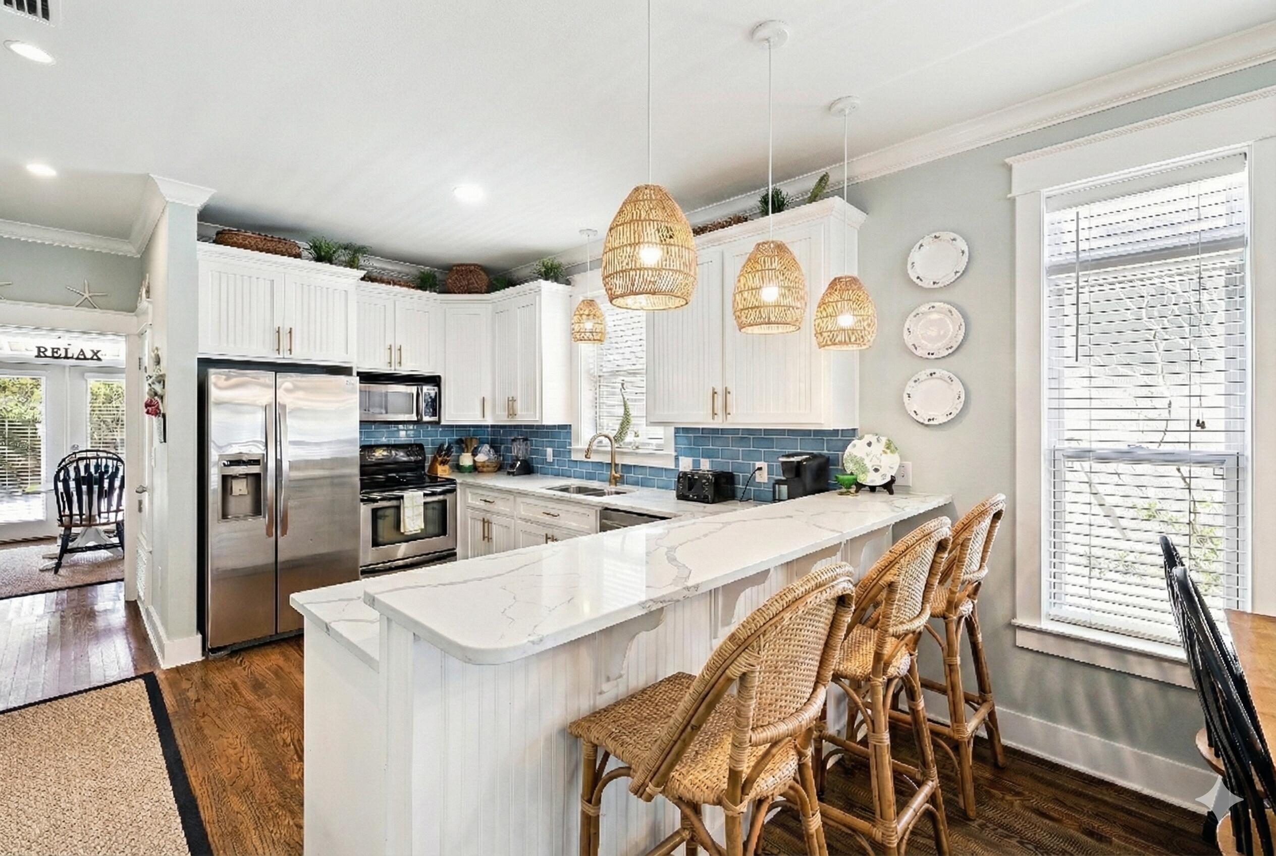 54 Surfer Lane Seacrest, FL 32461 - Photo 5 of 47 a kitchen with granite countertop a refrigerator a stove a sink dishwasher and white cabinets with wooden floor