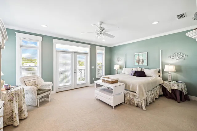 a kitchen with granite countertop white cabinets and black appliances