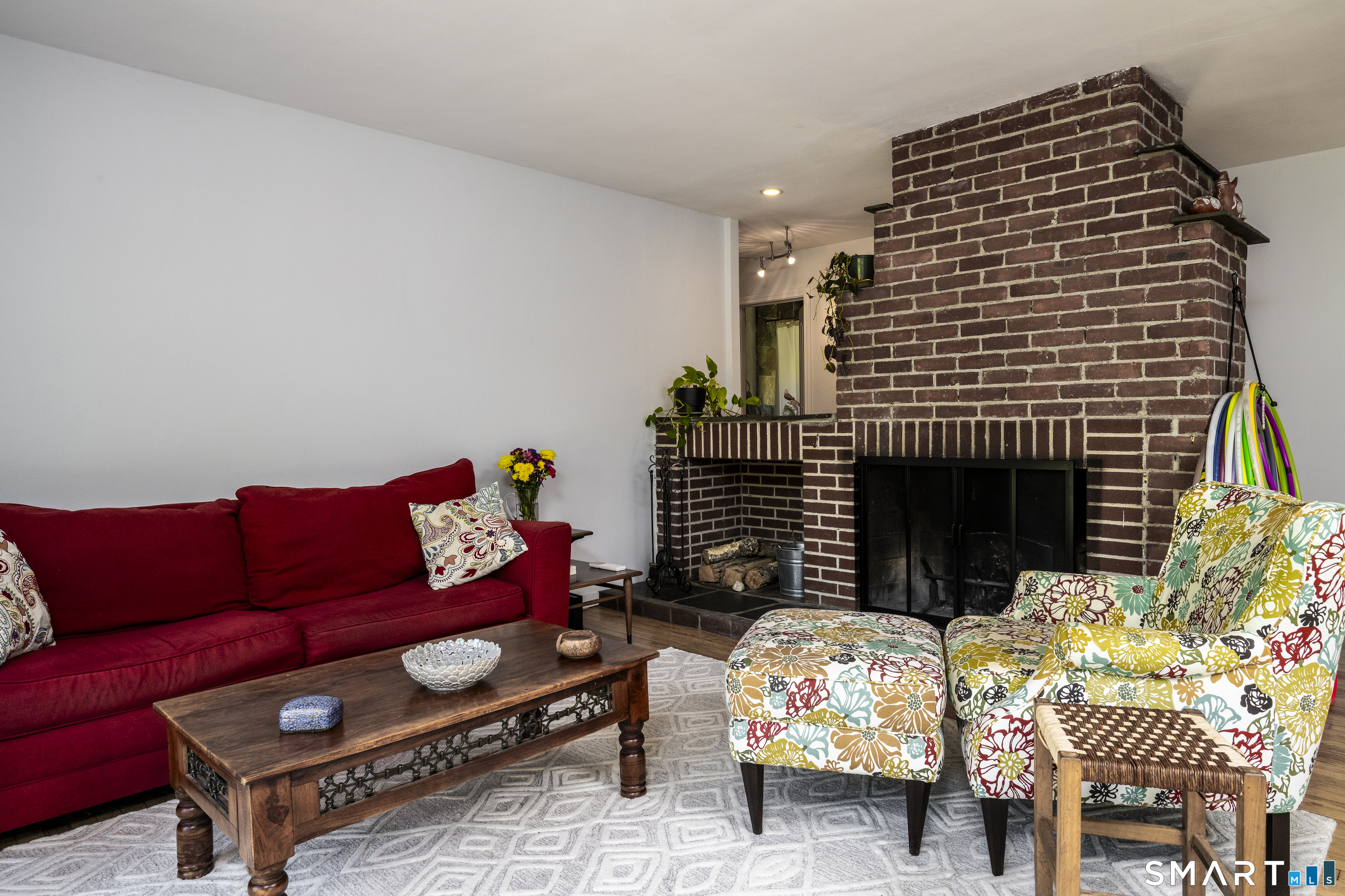 7 Chimney Rock Road Kent, CT 06757 - Photo 11 of 35 a living room with furniture a rug and a fireplace