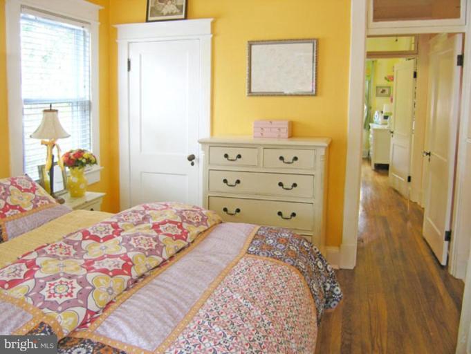 2005 Hanover Street Silver Spring, MD 20910 - Photo 2 of 28 a bedroom with a bed and wooden floor