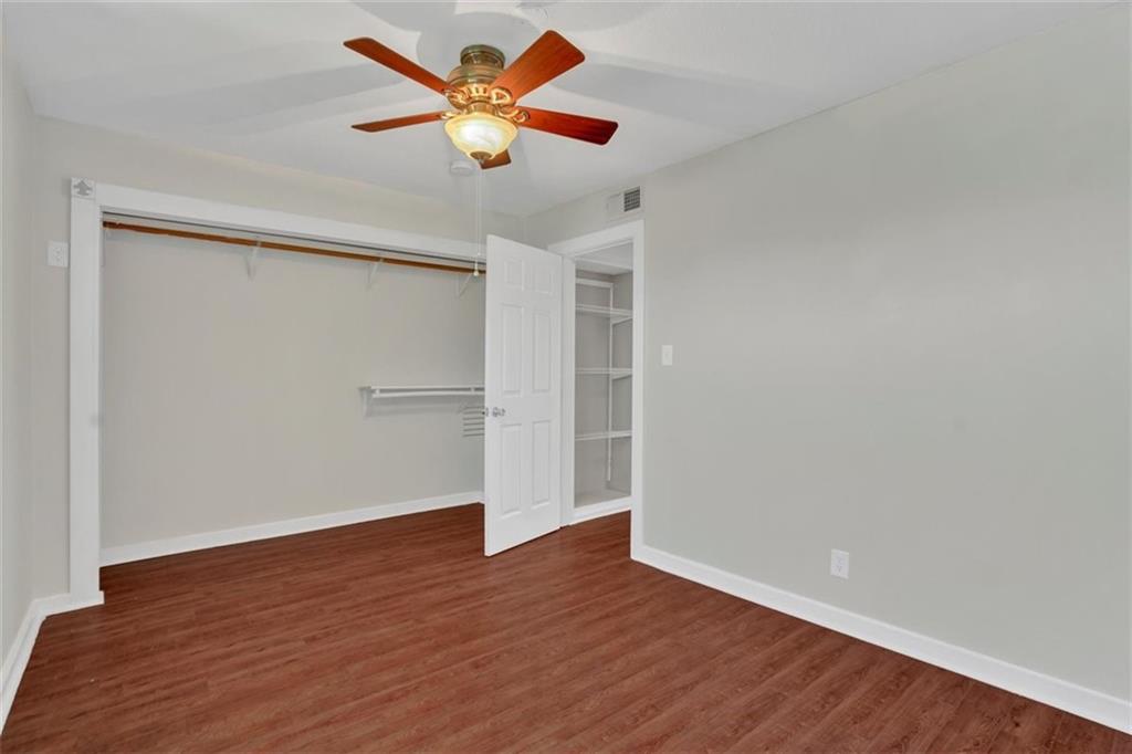 2000 Lightsey Road, Unit 1 Austin, TX 78704 - Photo 14 of 19 a view of an empty room with wooden floor and a ceiling fan