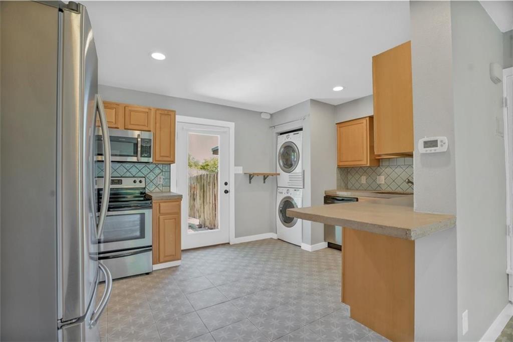2000 Lightsey Road, Unit 1 Austin, TX 78704 - Photo 7 of 19 a kitchen with a refrigerator and a sink