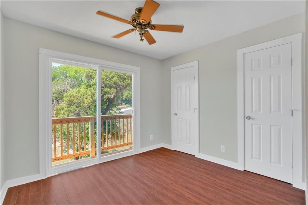 2000 Lightsey Road, Unit 1 Austin, TX 78704 - Photo 10 of 19 a view of an empty room with a window and wooden floor