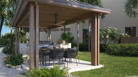 a patio with table and chairs potted plants and floor to ceiling window