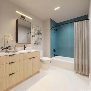 a bathroom with a double vanity sink toilet mirror and bathtub