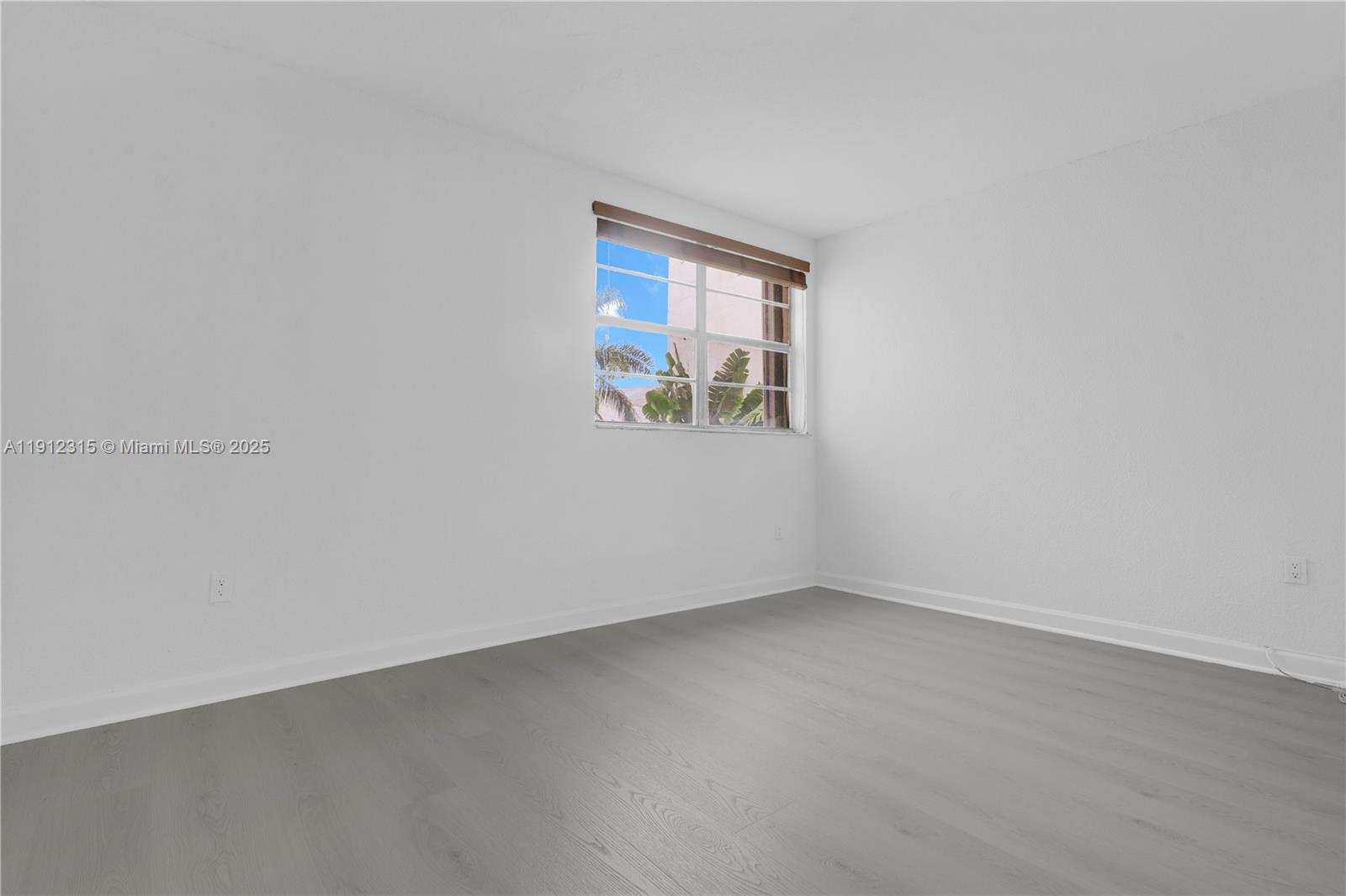 10900 Southwest 104th Street, Unit 121 Miami, FL 33176 - Photo 15 of 34 an empty room with a window