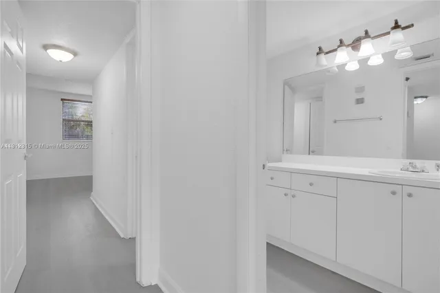 a bathroom with a bathtub a sink a toilet and a mirror