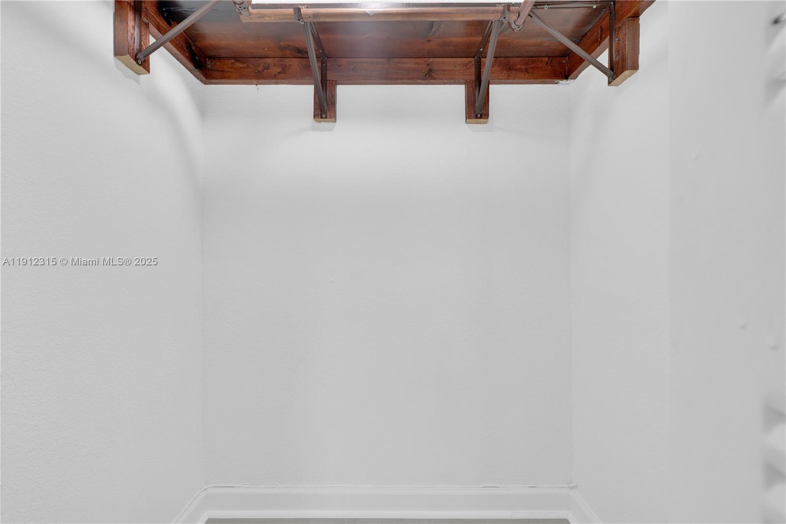 10900 Southwest 104th Street, Unit 121 Miami, FL 33176 - Photo 22 of 34 a view of small space with racks on the wall