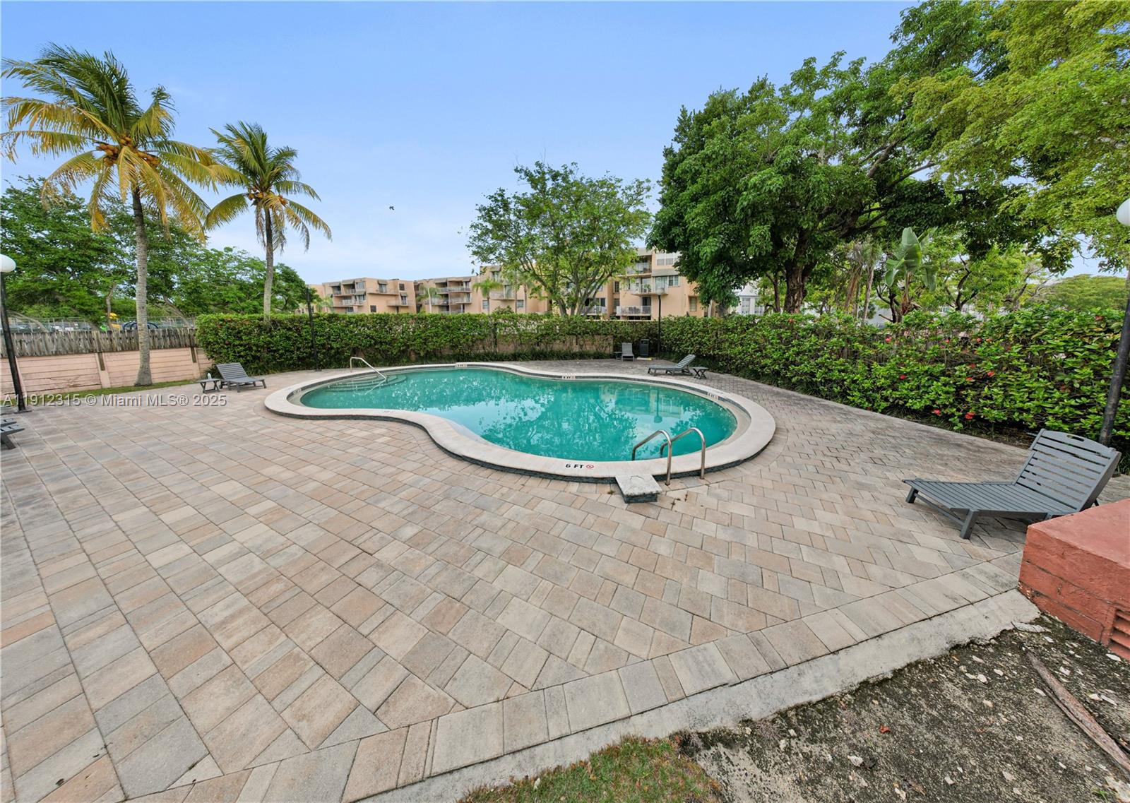 10900 Southwest 104th Street, Unit 121 Miami, FL 33176 - Photo 26 of 34 a view of a swimming pool with a yard