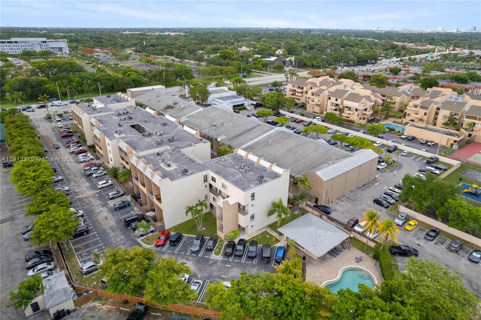 10900 Southwest 104th Street, Unit 121 Miami, FL 33176 - Photo 30 of 34 an aerial view of a city with lots of residential buildings